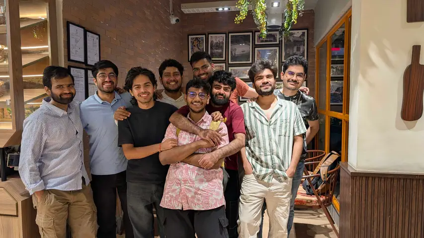 The team pressed together for a photo after dinner