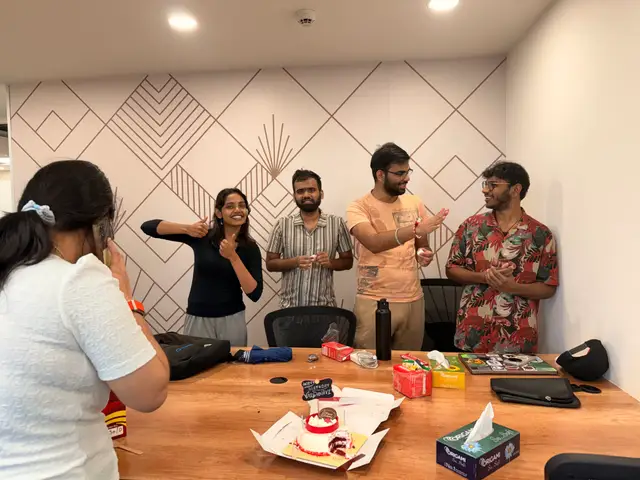 A birthday cake and applause in the meeting room