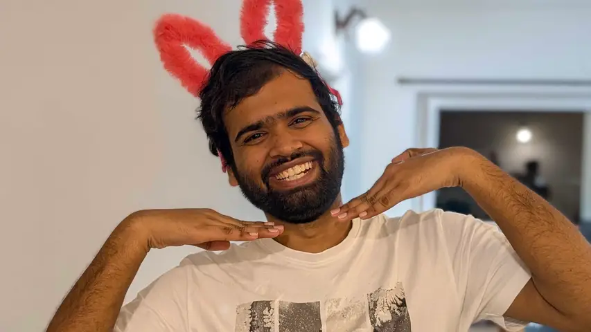 Bunny ears and a grin at a desk