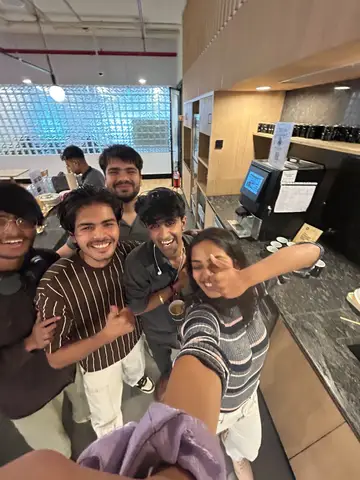 A selfie crowded in beside the coffee machine