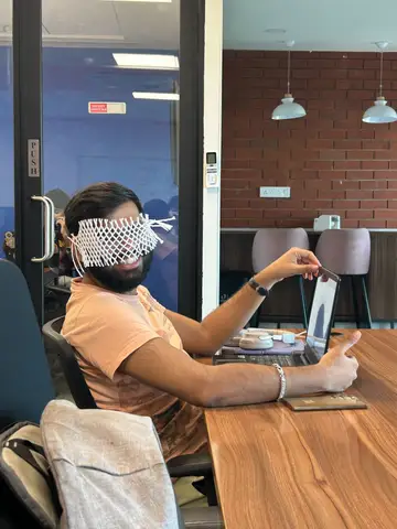 Working through a call wearing a macrame blindfold